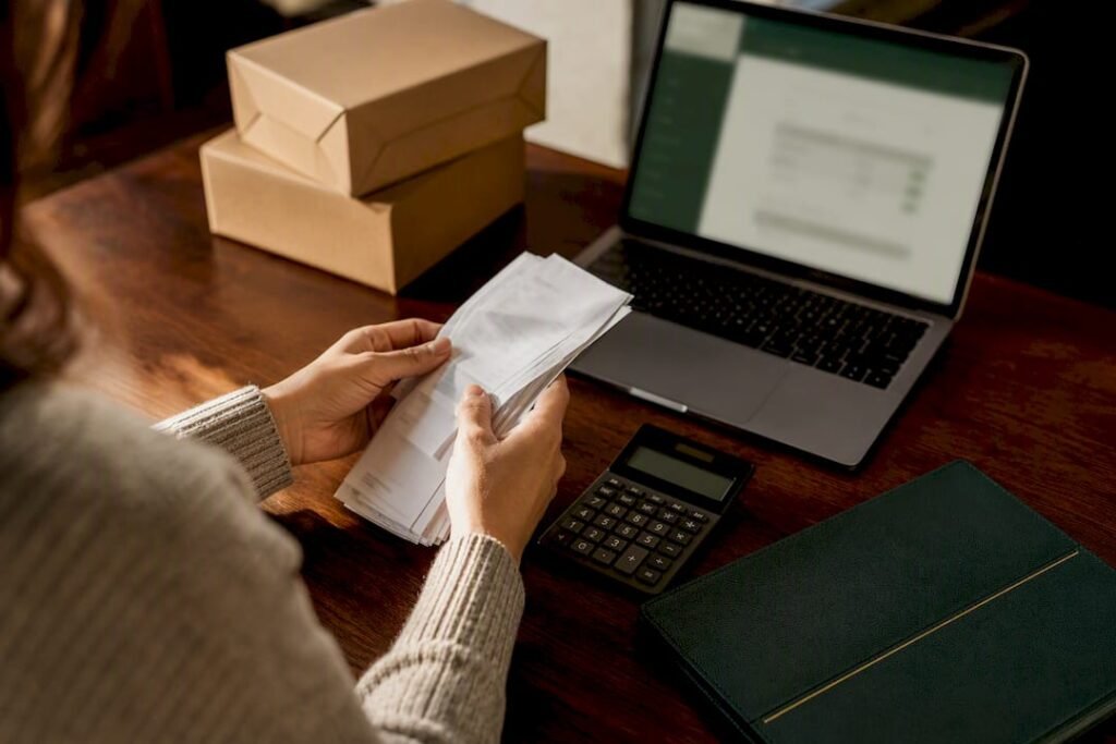 Ecommerce owner reconciling payout records