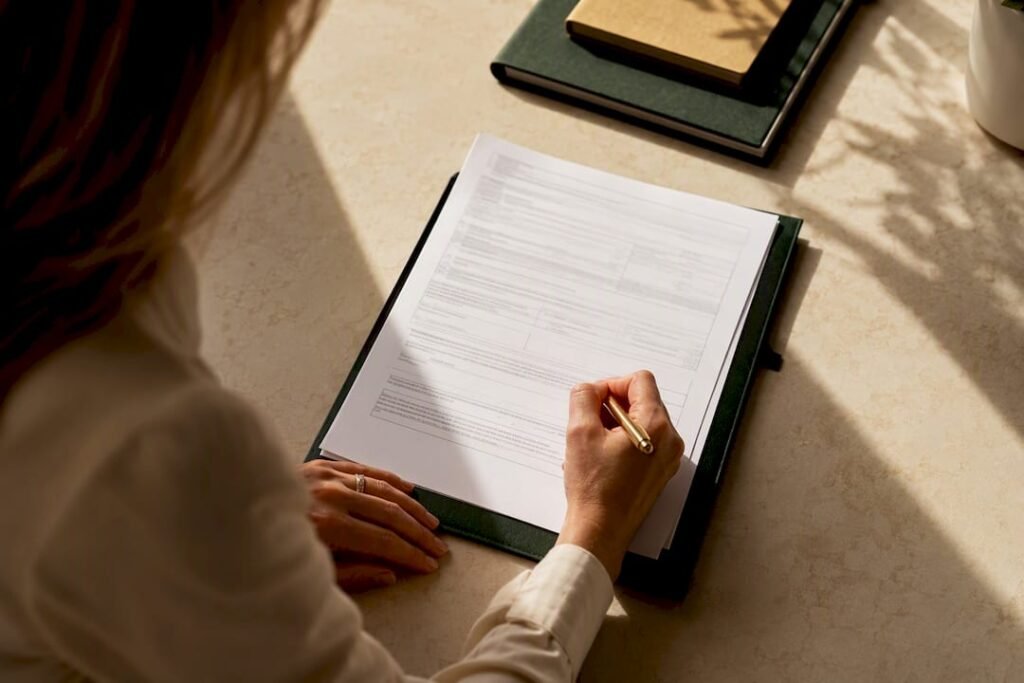 Business owner signing a tax form